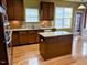 This open kitchen features a center island, stainless steel appliances, and a window over the sink at 501 Liberty Rose Dr, Morrisville, NC 27560