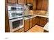 Featuring stainless steel appliances, granite countertops, and wooden cabinetry in kitchen at 501 Liberty Rose Dr, Morrisville, NC 27560