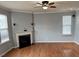 Spacious living room with hardwood floors, fireplace and large windows at 501 Liberty Rose Dr, Morrisville, NC 27560
