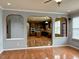 Spacious living room featuring hardwood floors with view into the kitchen area with stainless steel appliances at 501 Liberty Rose Dr, Morrisville, NC 27560