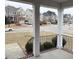 Covered porch showcasing the neighborhood view with well-maintained lawns at 501 Liberty Rose Dr, Morrisville, NC 27560
