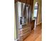 A large stainless steel refrigerator with water and ice dispenser stands next to wooden cabinets at 501 Liberty Rose Dr, Morrisville, NC 27560