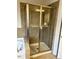 Modern glass-enclosed shower with tiled walls and a built-in shelf at 501 Liberty Rose Dr, Morrisville, NC 27560