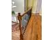 Stairway with hardwood steps and ornate metal railings leading to the second floor at 501 Liberty Rose Dr, Morrisville, NC 27560