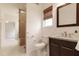 Renovated bathroom includes dark vanity, granite counters, and a stylish tiled shower at 524 Farmington Woods Dr, Cary, NC 27511