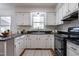 Well-equipped kitchen with modern appliances, ample counter space, and sleek cabinetry at 524 Farmington Woods Dr, Cary, NC 27511