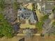 An aerial view of the property with manicured landscaping, mature trees, and a spacious lot at 601 Golfers Vw, Pittsboro, NC 27312