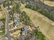 An aerial view of the house located on a golf course in a beautiful neighborhood at 601 Golfers Vw, Pittsboro, NC 27312