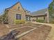Backyard featuring a well-maintained lawn, brick patio and lush landscaping at 601 Golfers Vw, Pittsboro, NC 27312