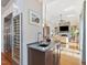 Wet bar with granite counters, modern sink, and wine fridge, perfect for entertaining at 601 Golfers Vw, Pittsboro, NC 27312