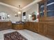 Bathroom showcasing a soaking tub, granite counters, and custom cabinetry at 601 Golfers Vw, Pittsboro, NC 27312
