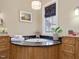 Bathroom featuring a whirlpool tub with dark granite counters at 601 Golfers Vw, Pittsboro, NC 27312