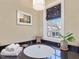 Bathroom showcasing a whirlpool tub with dark granite counters at 601 Golfers Vw, Pittsboro, NC 27312
