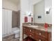 Bathroom featuring a granite vanity, large mirror, and shower/tub combo at 601 Golfers Vw, Pittsboro, NC 27312