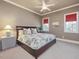 Comfortable bedroom featuring a queen-size bed and cozy furnishings at 601 Golfers Vw, Pittsboro, NC 27312