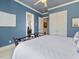 Spacious blue bedroom with a connecting ensuite bath and walk-in closets at 601 Golfers Vw, Pittsboro, NC 27312