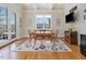 Bright dining room with hardwood floors, white trim, and a large window provides natural light at 601 Golfers Vw, Pittsboro, NC 27312