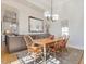 Dining room featuring a wooden table, six chairs, and large wall mirror at 601 Golfers Vw, Pittsboro, NC 27312