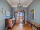 Elegant entryway featuring hardwood floors, arched doorways, and stylish decor at 601 Golfers Vw, Pittsboro, NC 27312