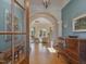 Welcoming entryway with hardwood floors, archways, and elegant decor at 601 Golfers Vw, Pittsboro, NC 27312