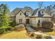 Well maintained stone home featuring a garden and manicured lawn at 601 Golfers Vw, Pittsboro, NC 27312