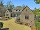 Beautiful exterior showcasing manicured landscaping, and an outdoor patio at 601 Golfers Vw, Pittsboro, NC 27312