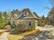 Well maintained stone home featuring a garden and side-entry garage at 601 Golfers Vw, Pittsboro, NC 27312