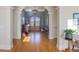 Hardwood foyer showcasing arched doorways and sophisticated furnishings at 601 Golfers Vw, Pittsboro, NC 27312