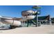 Community pool area featuring a waterslide, lifeguard stand and covered seating at 601 Golfers Vw, Pittsboro, NC 27312