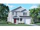 Charming two-story home featuring light-gray siding, a welcoming front porch, and an attached single-car garage at 6048 Sodium St, Raleigh, NC 27610