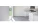 Sun-lit dining area and kitchen with stainless steel appliances and granite countertops at 6048 Sodium St, Raleigh, NC 27610