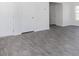 Contemporary living room showcasing modern wood floors and crisp white walls at 6048 Sodium St, Raleigh, NC 27610