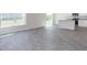 Spacious living room featuring modern wood flooring and natural light at 6048 Sodium St, Raleigh, NC 27610