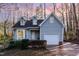 Charming home with a well-manicured front yard, attached garage, and inviting curb appeal at 6800 Chamonix Pl, Raleigh, NC 27613