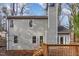 Rear exterior featuring a wooden deck, steps to the yard and grey siding on the house at 6800 Chamonix Pl, Raleigh, NC 27613