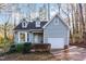 Charming home with a well-manicured front yard, attached garage, and inviting curb appeal at 6800 Chamonix Pl, Raleigh, NC 27613
