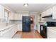 Functional kitchen featuring white cabinets, modern appliances, and an open layout at 6800 Chamonix Pl, Raleigh, NC 27613