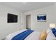 Bedroom with TV and en suite bathroom entrance at 7201 Spanglers Spring Way, Raleigh, NC 27610