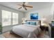 Cozy bedroom with a large window, stylish artwork, and comfortable bedding at 7201 Spanglers Spring Way, Raleigh, NC 27610