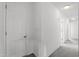 Bright hallway with white trim, neutral walls, and access to multiple rooms at 7201 Spanglers Spring Way, Raleigh, NC 27610