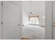 Bright living room featuring neutral tones, large windows, and a ceiling fan at 7201 Spanglers Spring Way, Raleigh, NC 27610