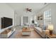 Bright living room with neutral tones, ceiling fan, and plenty of natural light at 7201 Spanglers Spring Way, Raleigh, NC 27610