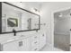 Modern bathroom featuring double vanity with black hardware at 9004 Penny Rd, Raleigh, NC 27606