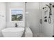 Modern bathroom featuring free-standing tub, glass shower and natural light at 9004 Penny Rd, Raleigh, NC 27606