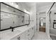 Beautiful bathroom features a double sink vanity, walk in shower, and neutral walls and trim at 9004 Penny Rd, Raleigh, NC 27606