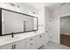Bathroom featuring double sink vanity, modern fixtures, with a large mirror at 9004 Penny Rd, Raleigh, NC 27606
