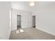 Neutral carpet in bedroom with fresh white paint, closet and bathroom doors at 9004 Penny Rd, Raleigh, NC 27606