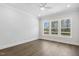 Bright and airy bedroom with three large windows and hardwood floors, offering natural light and space at 9004 Penny Rd, Raleigh, NC 27606