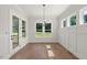Bright dining room with hardwood floors and a view to the outdoors at 9004 Penny Rd, Raleigh, NC 27606