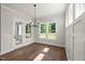 Dining area with hardwood floors, windows, and natural light at 9004 Penny Rd, Raleigh, NC 27606